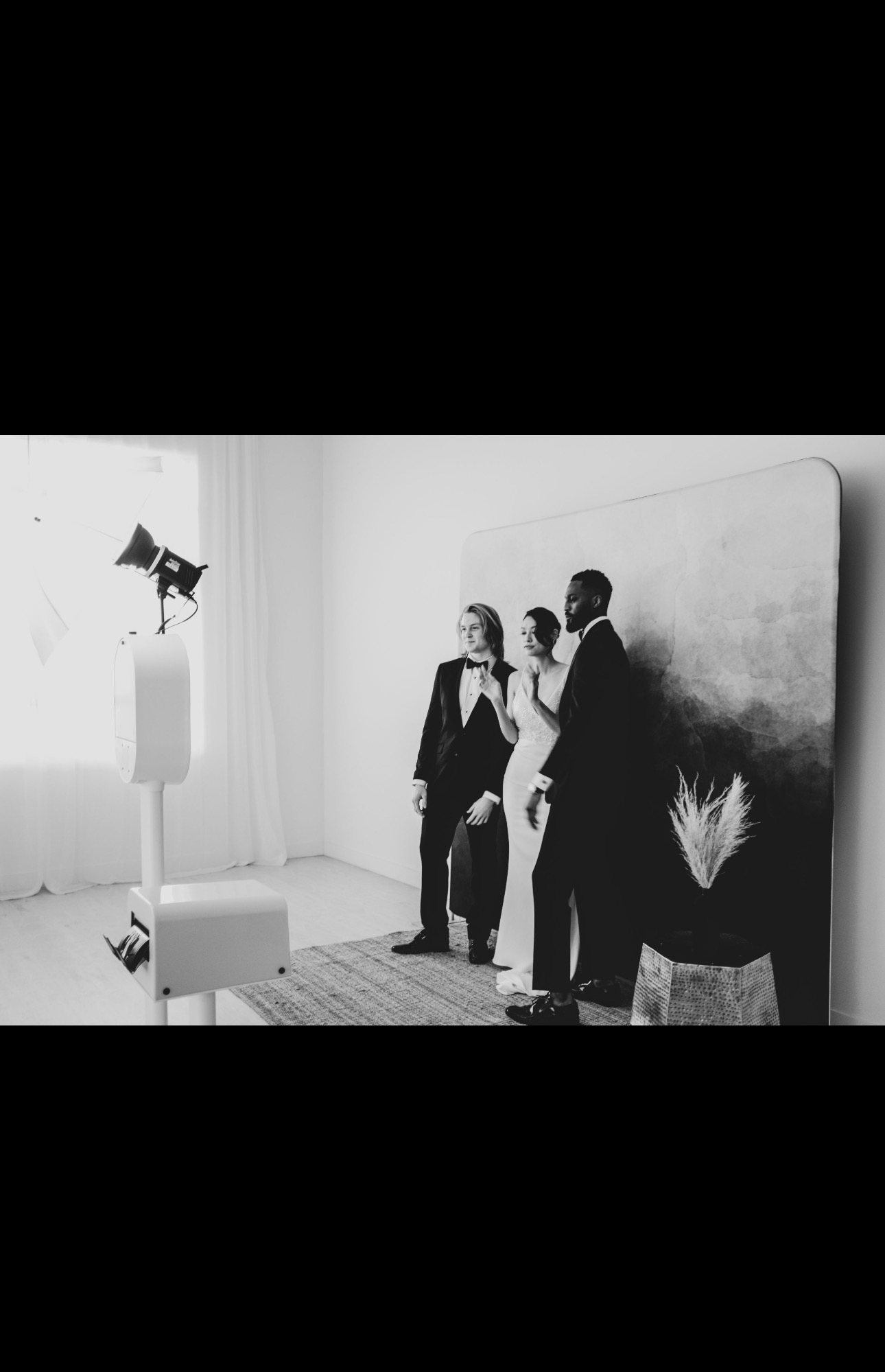 Guests posing together in the luxury photo booth